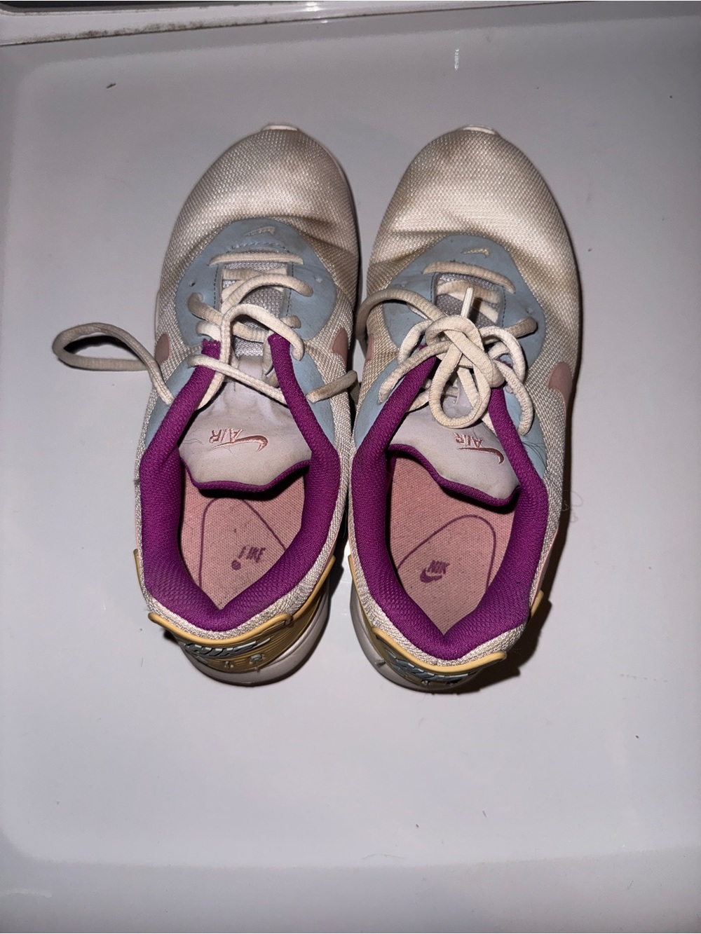 Nike Women's White Athletic Sneakers with Purple and Blue Accents